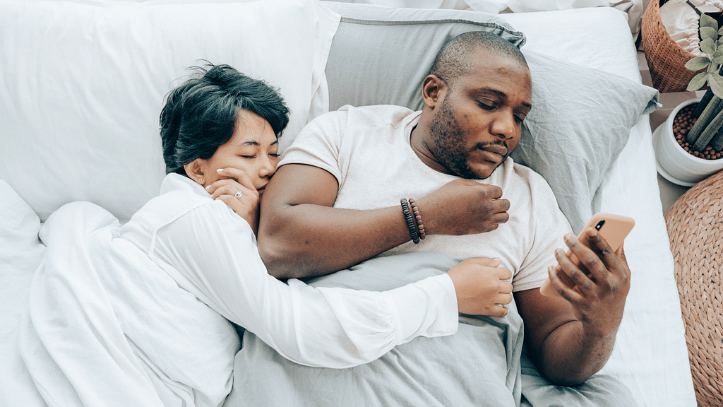 man checking his partners phone because insecurity