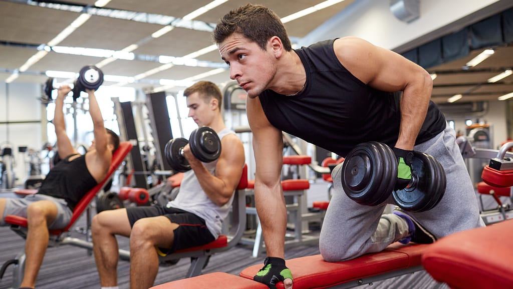 3 men working out in the gym